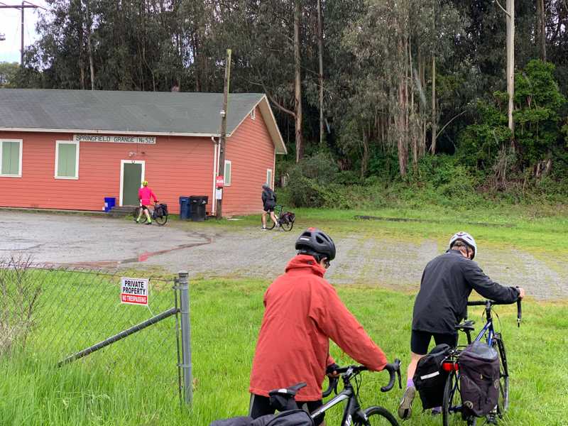 Waiting out the rain under the roof of this barn-like structure in Watsonville, California: "there's a scene in The Grapes of Wrath like this." Photo by Cooper Grace.